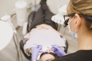 dentist working on patient's teeth